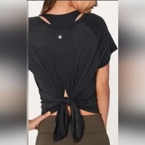 Lululemon top with open back. Black, like new. Size 4.
